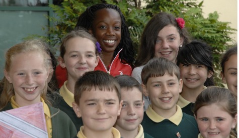 Triple jumper Ayanna Alexander meets the youngsters from St Helen’s Primary School in Barry.